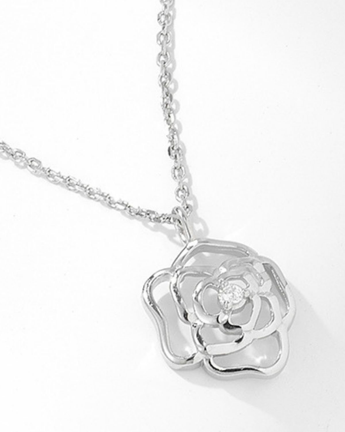 floral-rose-outline-pendant.jpg Floral rose pendant necklace in rhodium